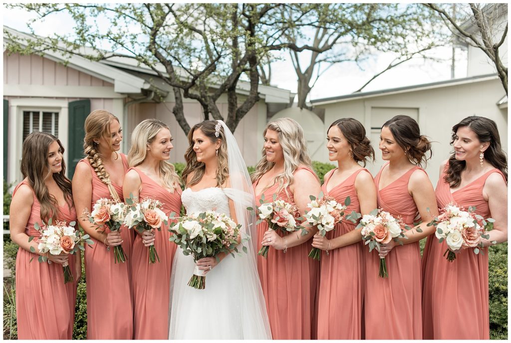 bride with her seven bridesmaids other either side of her wearing blush gowns in leola, pennsylvania