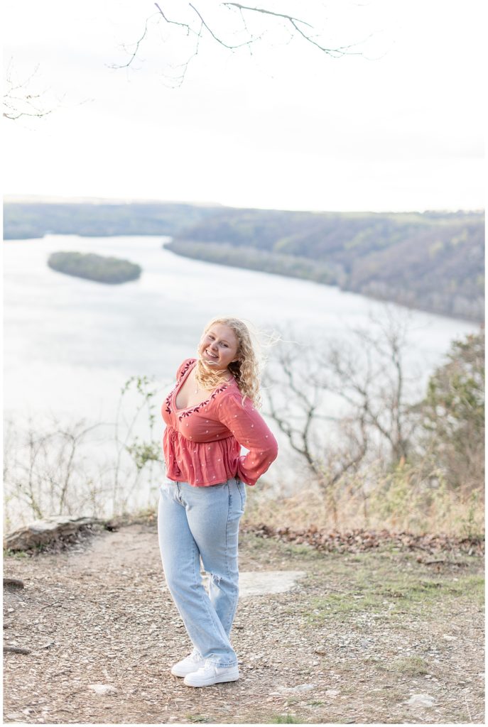 girl senior spokesmodel in pink shirt and blue jeans atop pinnacle point overlook in holtwood pennsylvania