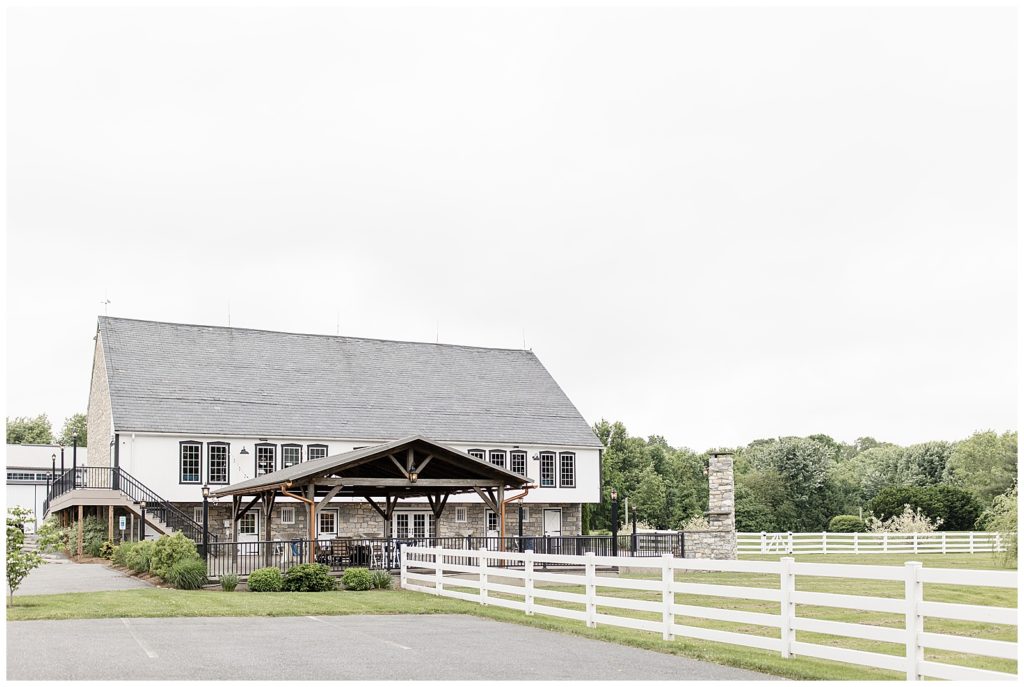 beautiful white barn with white fence at the barn at silverstone in lancaster pennsylvania