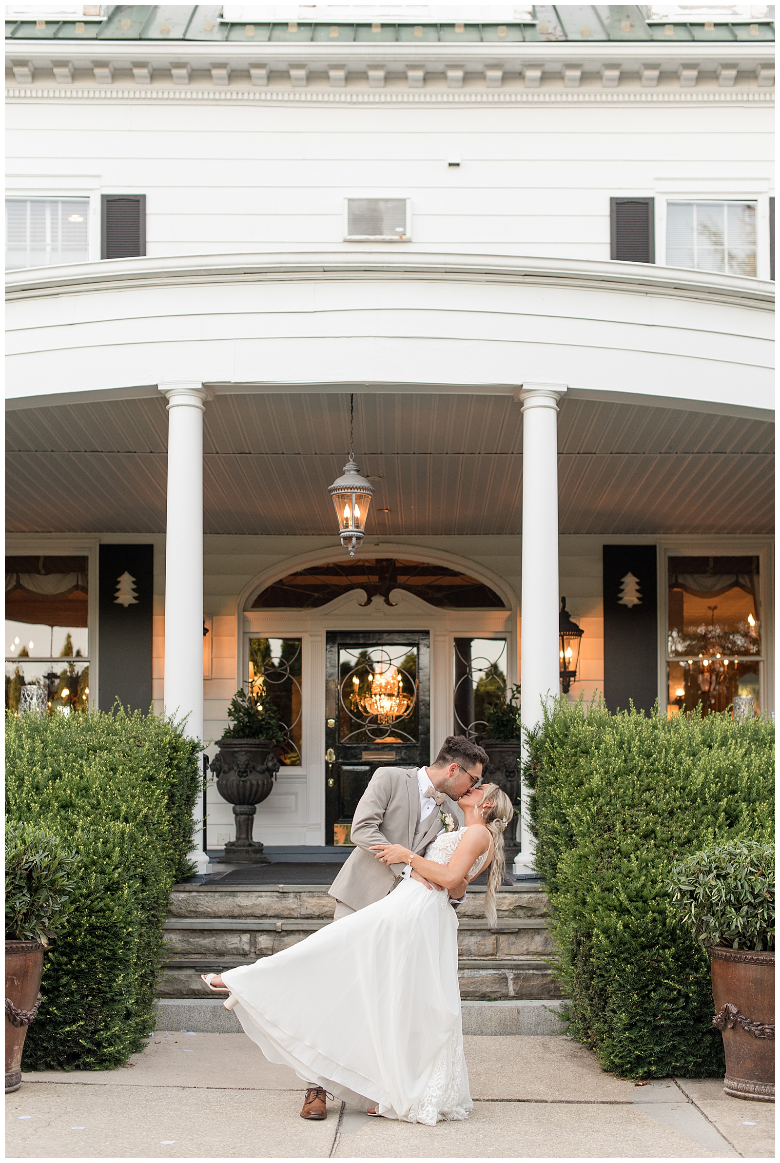 bride and groom dipping in front of Mansion at Valley Country Club in Maryland