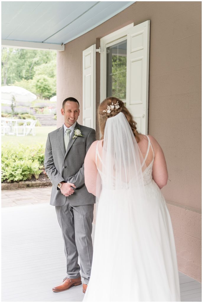 bride and groom sharing a first look moment outside home at elizabeth furnace in lititz pennsylvania