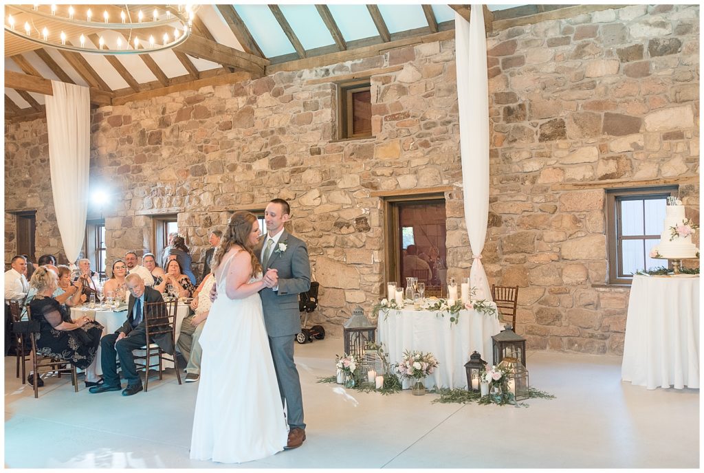 bride and groom sharing their first dance during their barn reception at elizabeth furnace in lancaster pennsylvania