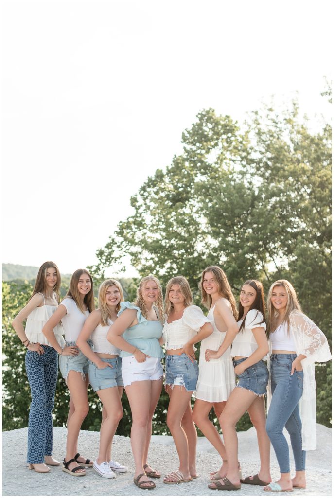 group of eight senior girl spokesmodels wearing white and blue with their hands on hips in lancaster county