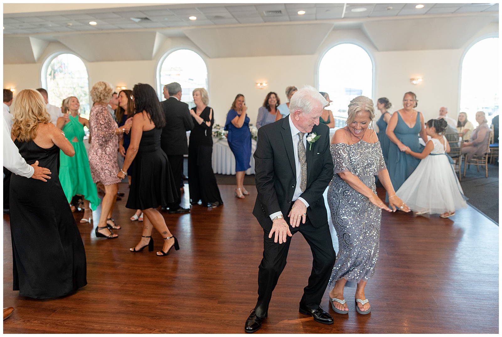 guests dancing and having fun during wedding reception at the bayview house at captain bill's in bay shore new york
