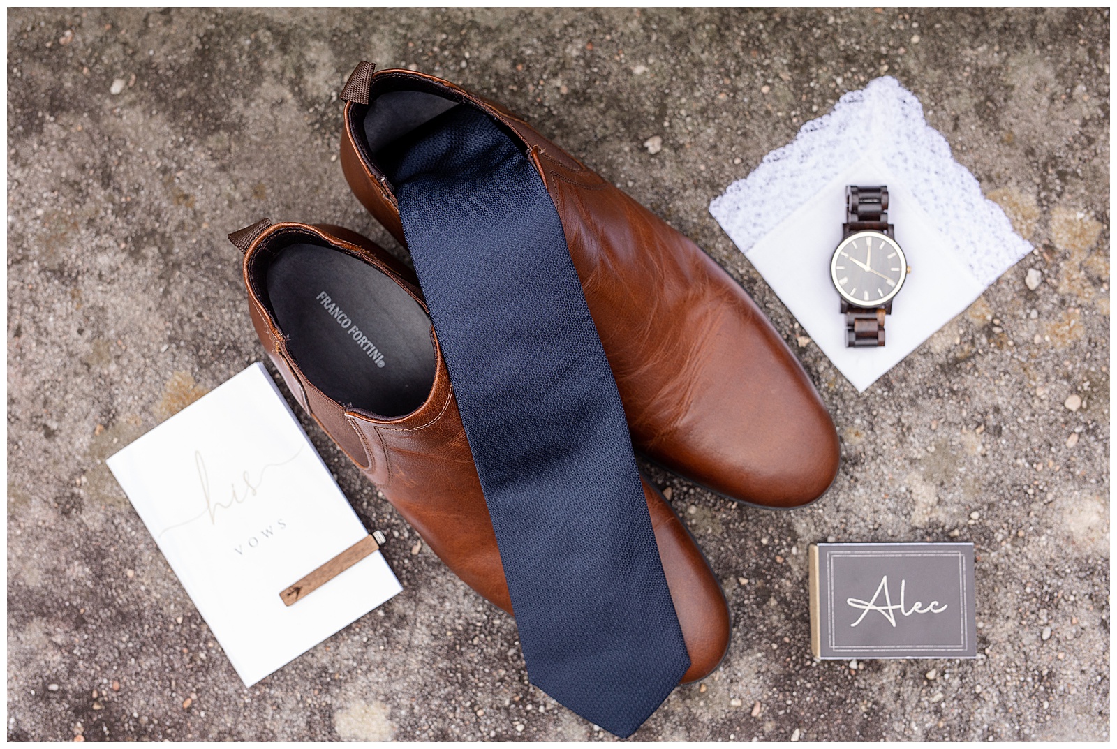 grooms brown shoes displayed with navy blue tie, wrist watch, and other accessories at elizabeth furnace