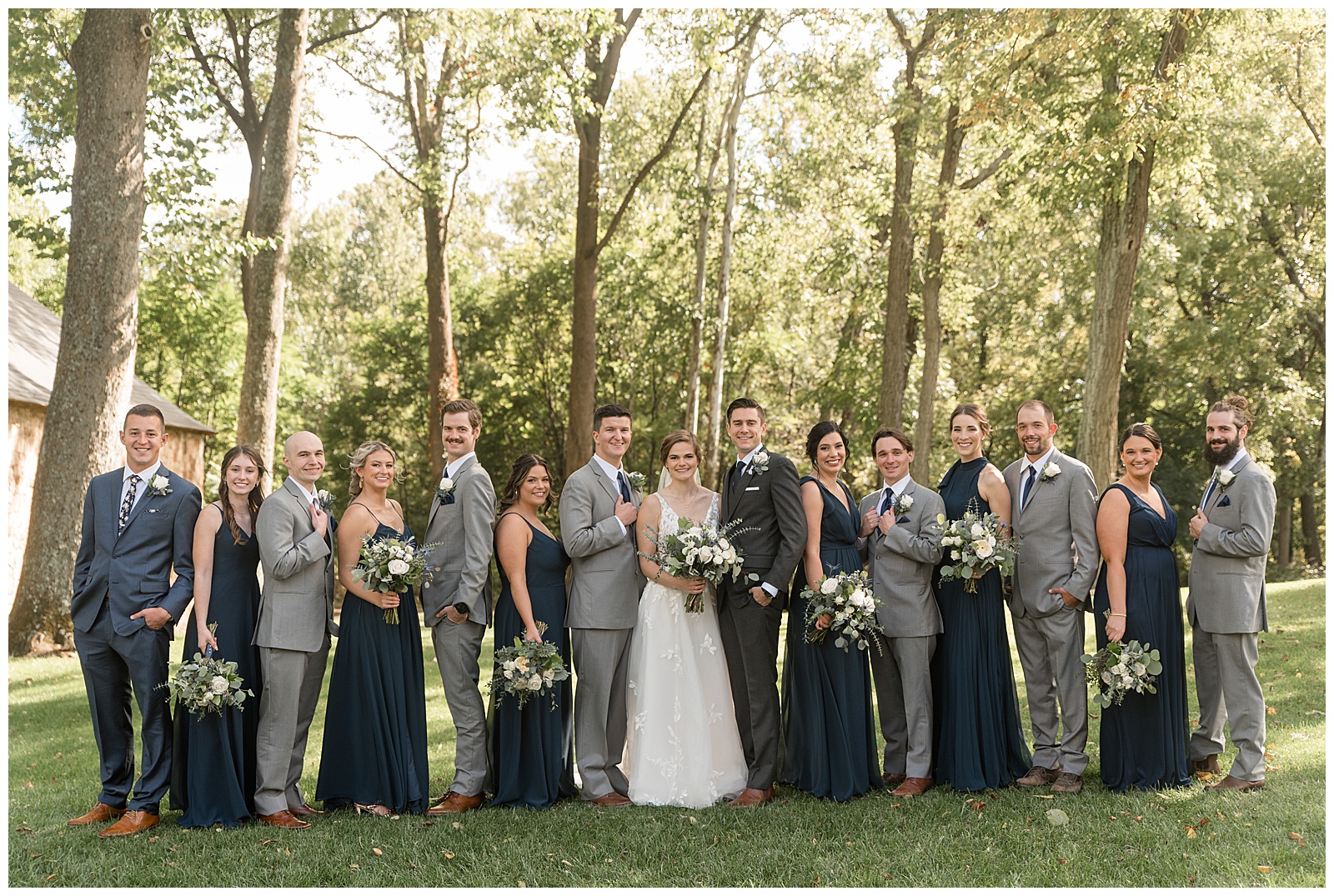 bride and groom standing in middle with their bridal party standing with a partner in opposite directions at elizabeth furnace
