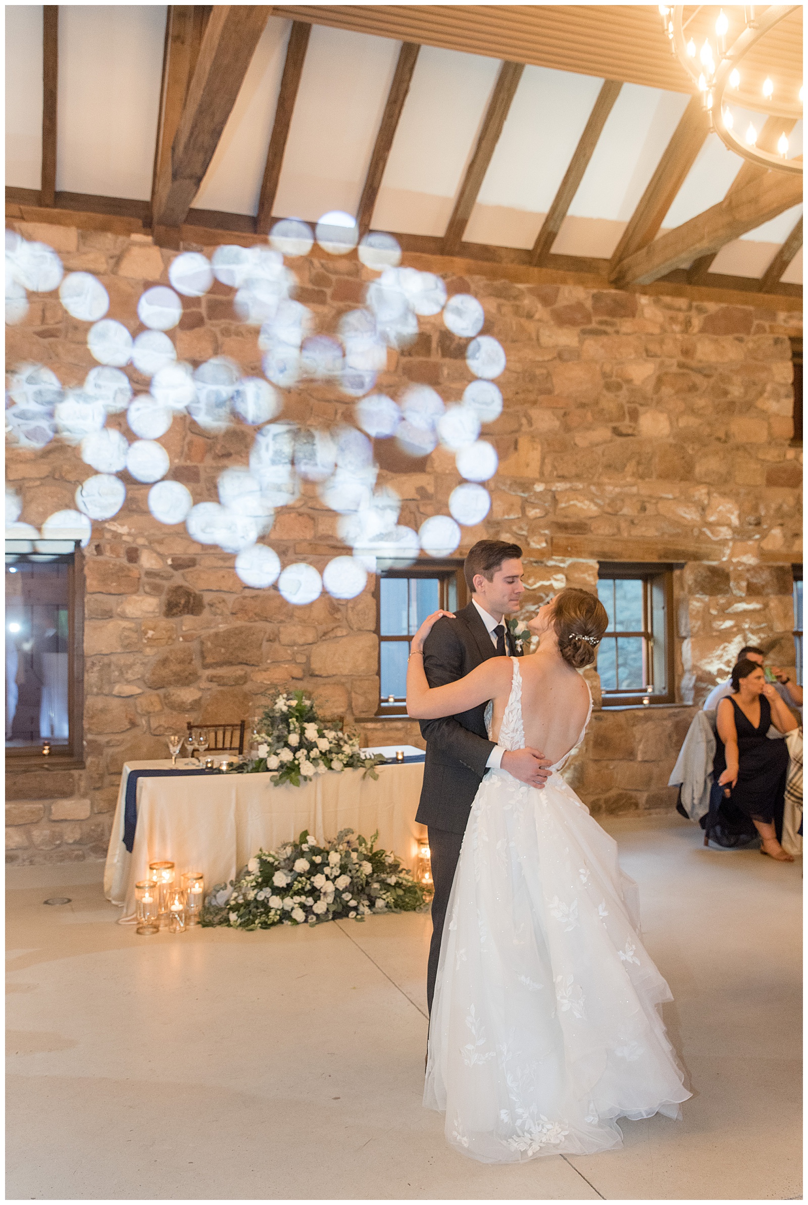 bride and groom sharing their first dance at indoor barn reception at elizabeth furnace in lititz pennsylvania