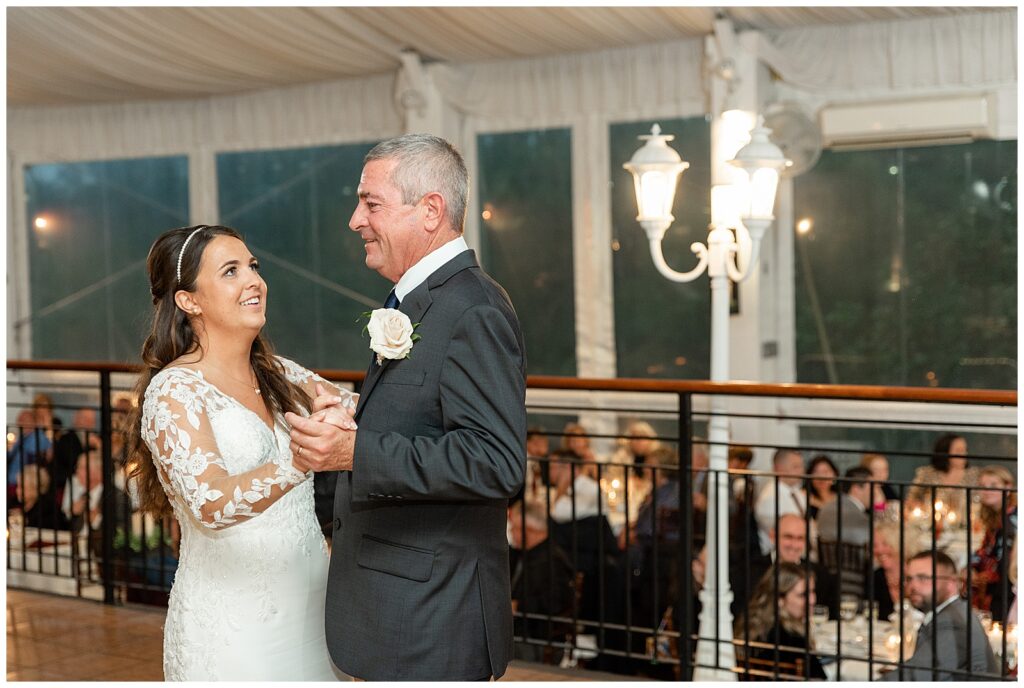 bride and her dad slow dancing during indoor reception at the manor house at prophecy creek in ambler pennsylvania