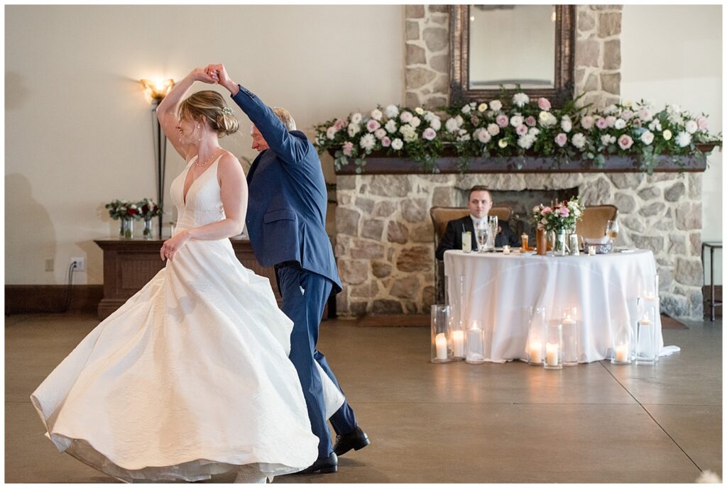 groom twirling his bride during the dance at reception at the inn at leola village