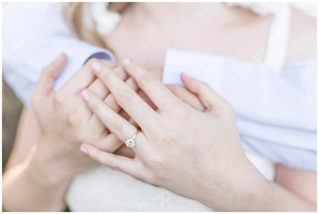 closeup photo of beautiful diamond engagement ring on bride-to-be at overlook park in lancaster pennsylvania