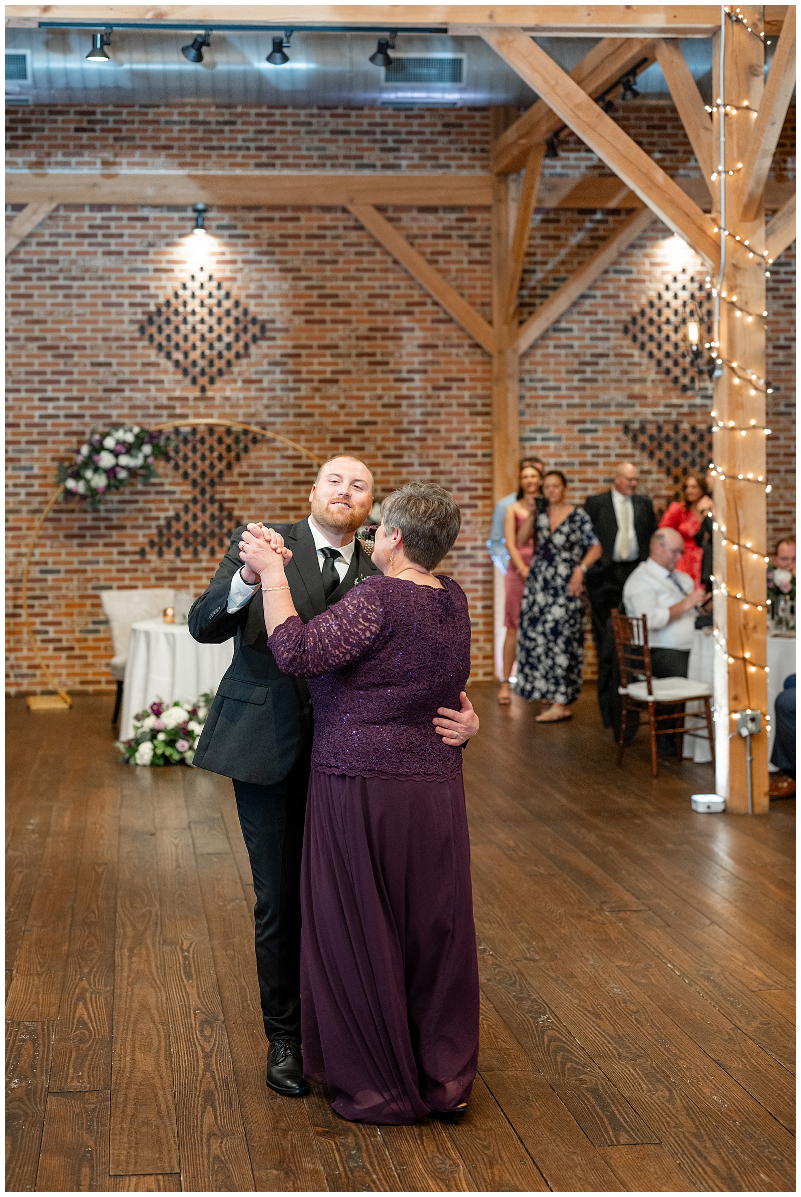 groom dancing with his mom during barn reception at brick gables in lancaster county