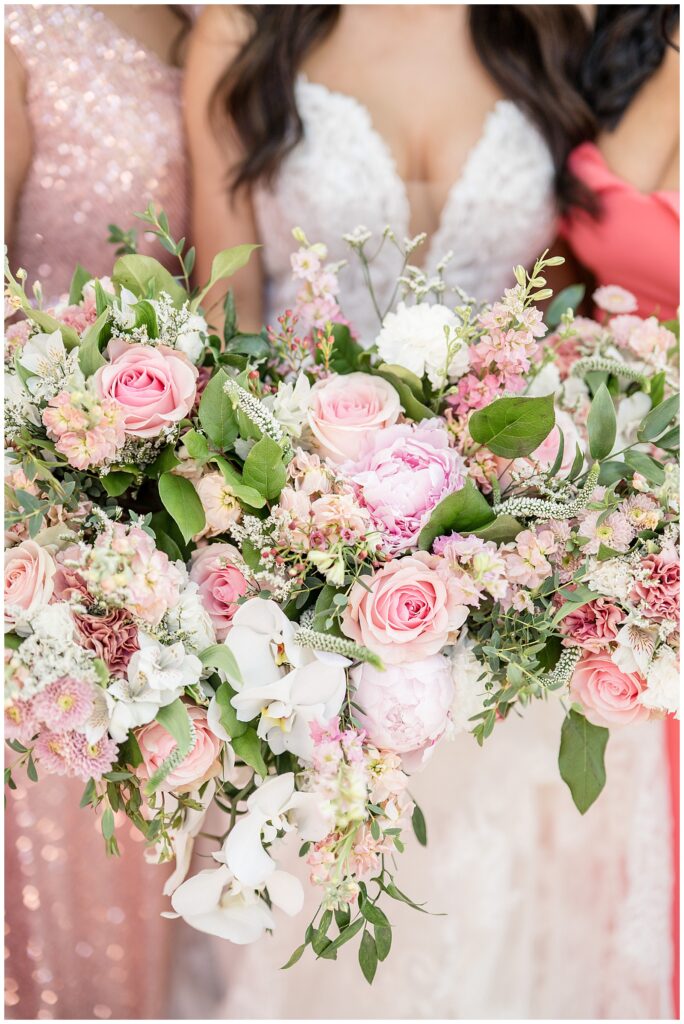 closeup photo of bouquets of light pink roses and eucalyptus at domaine pterion