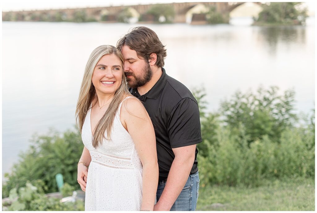 guy hugging girl from behind as they hold hands at john wright restaurant in york county pennsylvania