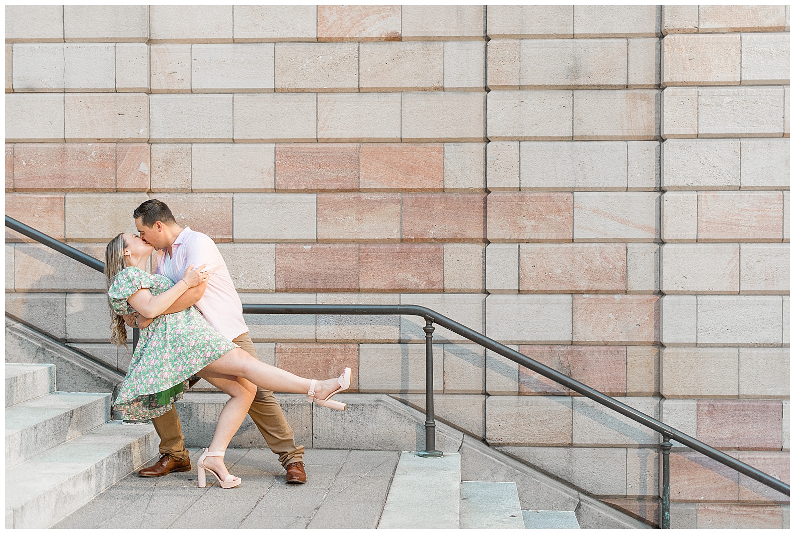 man dipping back his bride-to-be as they kiss on the steps of the courthouse in lancaster city