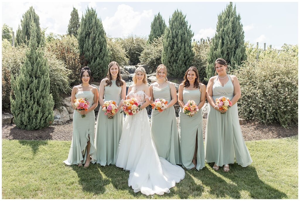 bride with her five bridesmaids in sage green gowns at folino estate winery