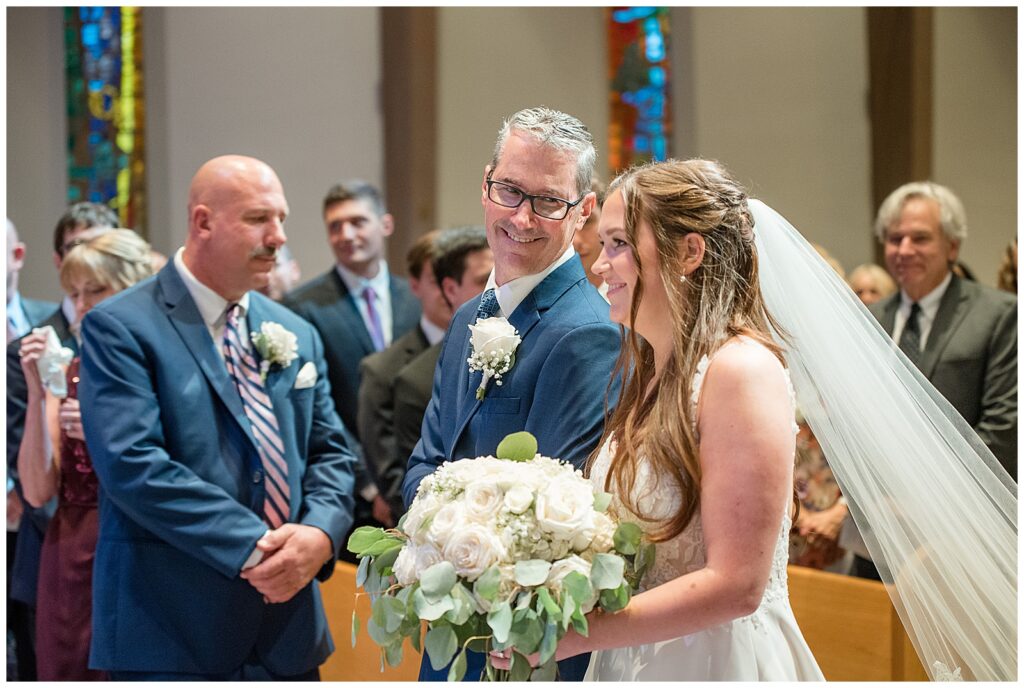 father walking his daughter down the aisle of presbyterian church in pennsylvania