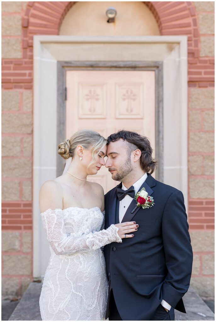 bride and groom resting their heads together as bride gently lays right hand on groom's chest in york pa