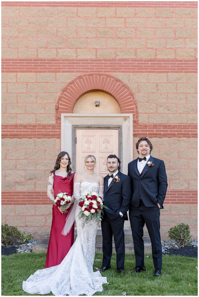 couple standing with their maid of honor and best man outside of annunciation greek orthodox church in york pennsylvania