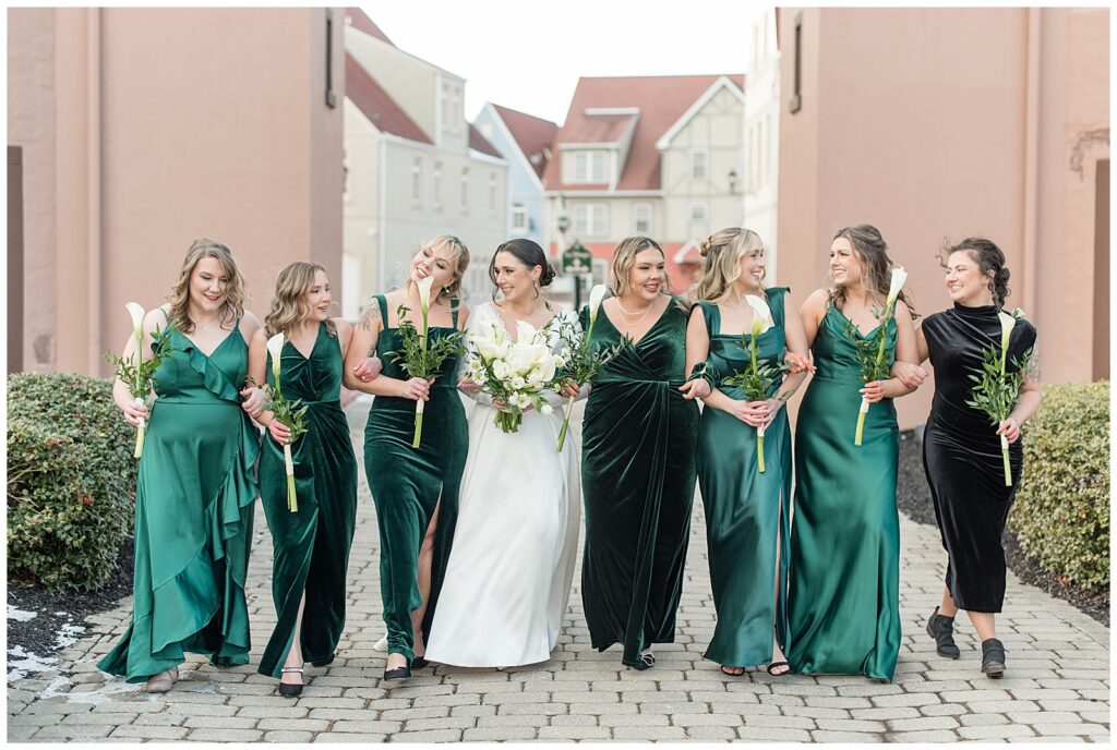 bride walking towards camera with her bridesmaids at stoudtburg village