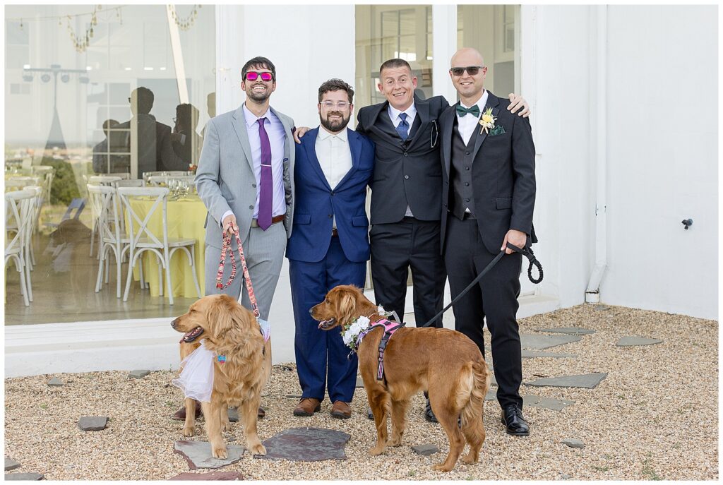 groom with his three groomsmen and two dogs smiling at camera at lauxmont farms in york county
