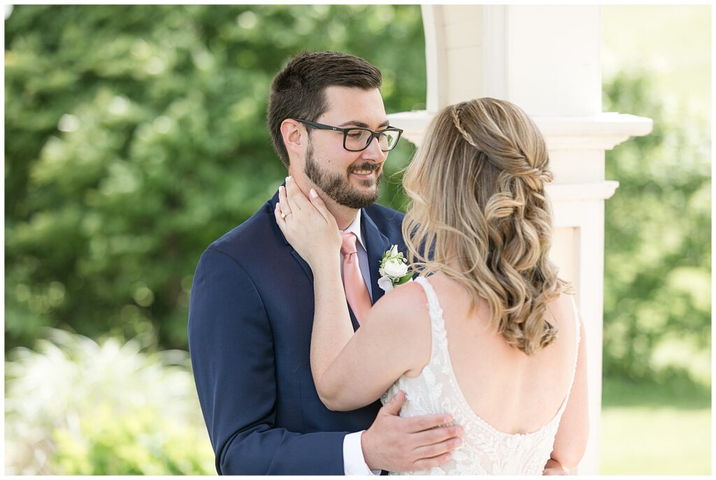 bride and groom share first look moment and hug for this Bryn Awel Manor Summer Wedding