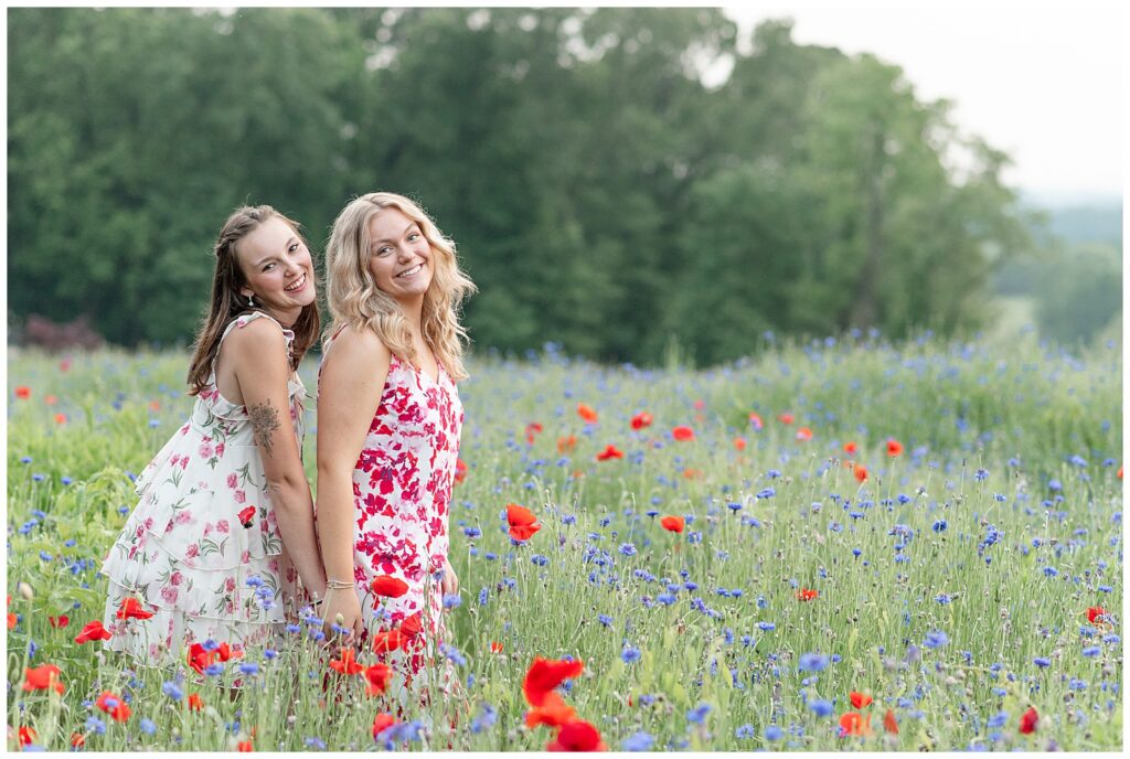 two senior spokesmodels standing close holding hands for this Senior Wildflower Lookout Session