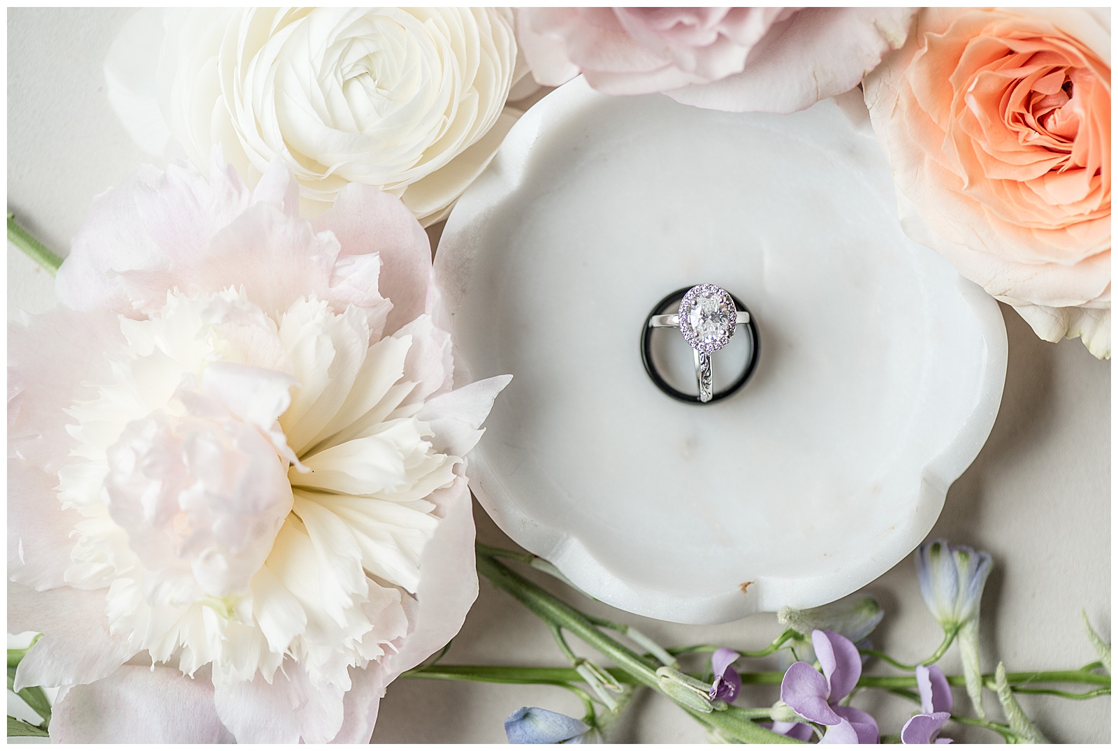 wedding rings in white porcelain bowl surrounded by peonies and white roses for this Inn at Leola Village Wedding