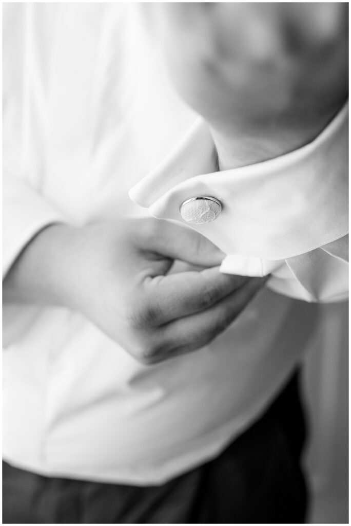 detail shot of groom's cufflink on his shirt