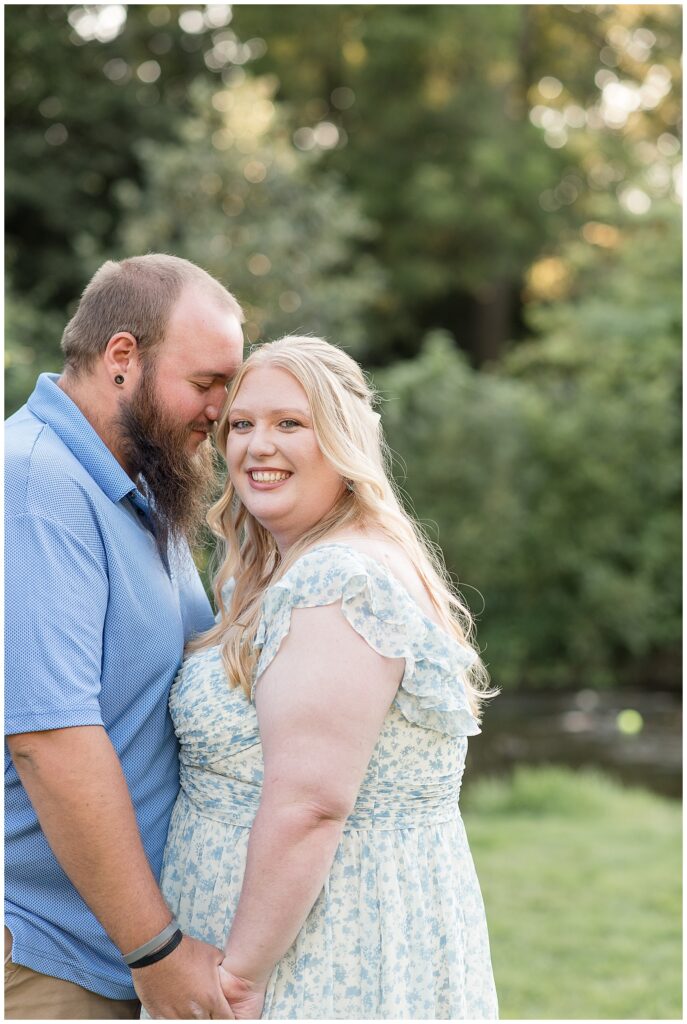 guy resting his forehead on girl's right temple for this Historic Poole Forge Summer Engagement Session