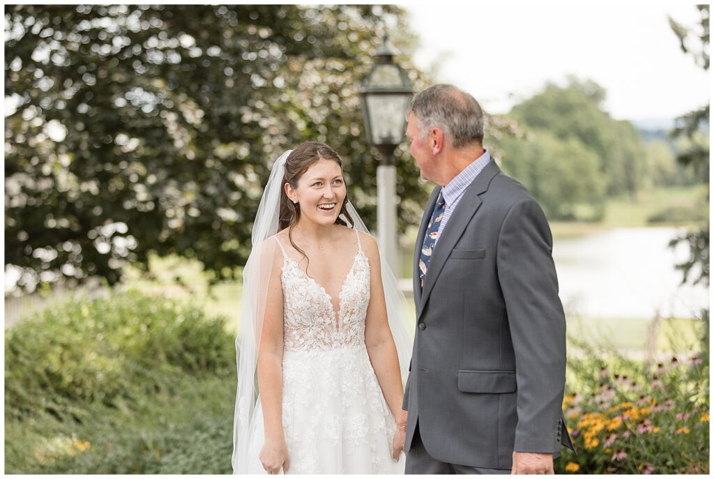 bride sharing first look moment with her dad at this Lakeview Farms Summer Wedding