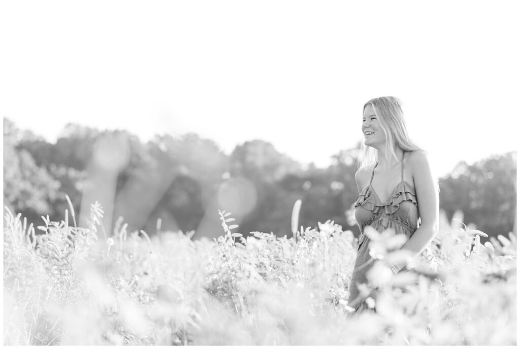 black and white photo of senior girl in dress for this Summer Wildflower Field Senior Session