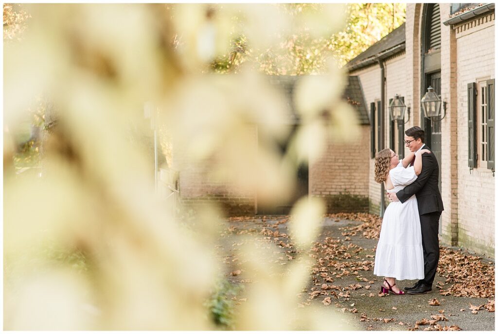 engaged couple hugging on fall day for this Conestoga House and Gardens Engagement Session