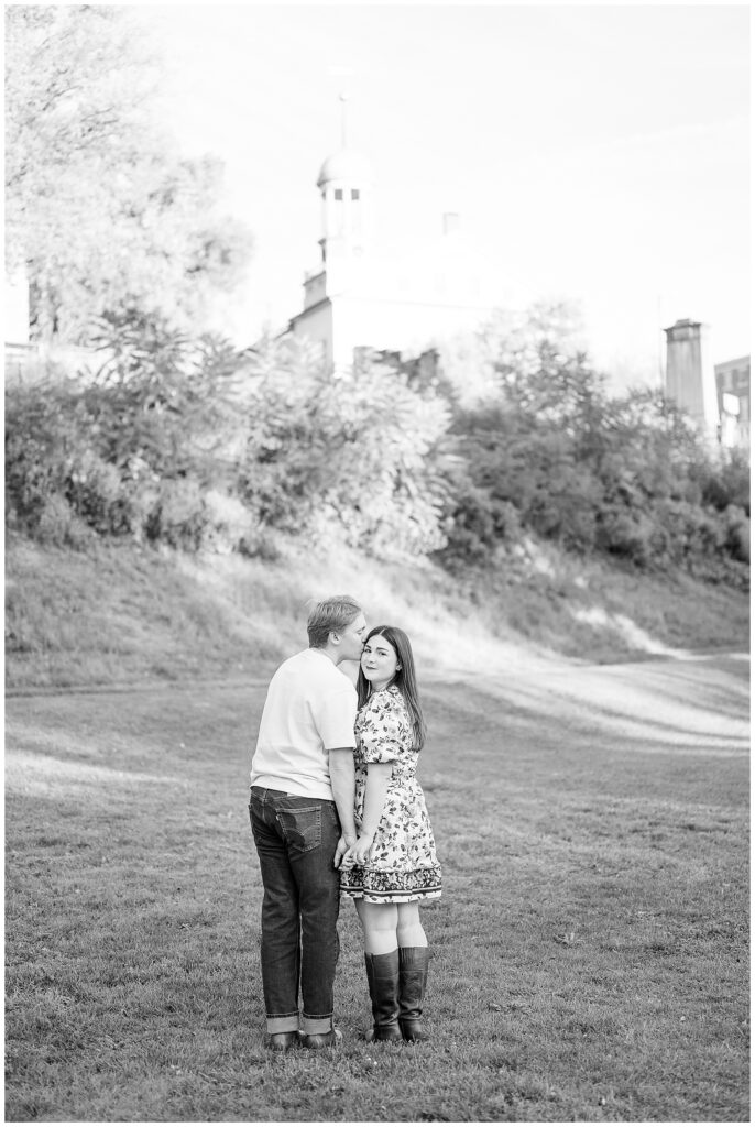 black and white photo of  of couple standing close and holding hands for this Downtown Bethlehem Engagement Session
