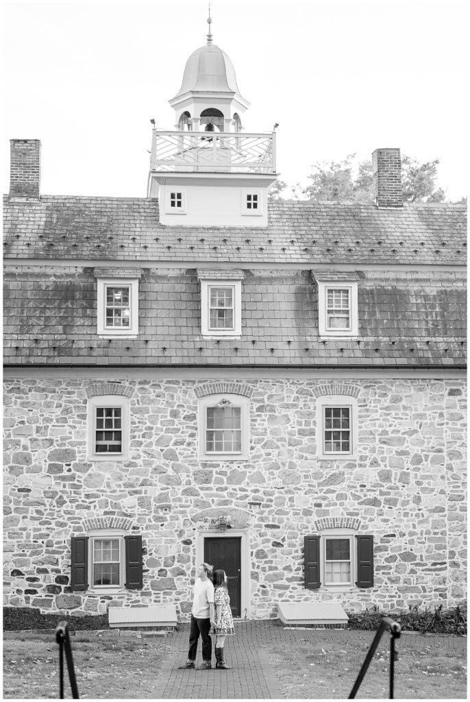 black and white photo of couple in front of historic stone building for this Downtown Bethlehem Engagement Session