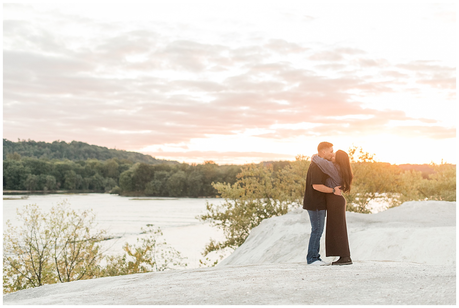 couple hugging and kissing at sunset for this White Cliffs of Conoy Fall Couples Session