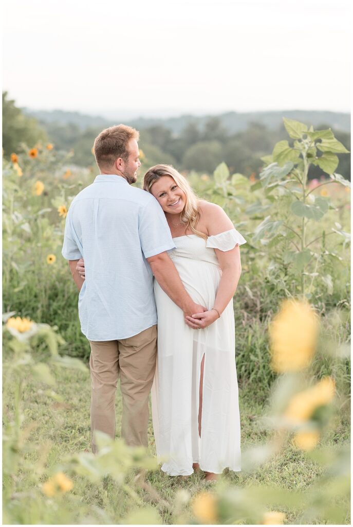 woman leaning against man's right shoulder for this Wildflower Overlook Maternity and Lifestyle Newborn Session