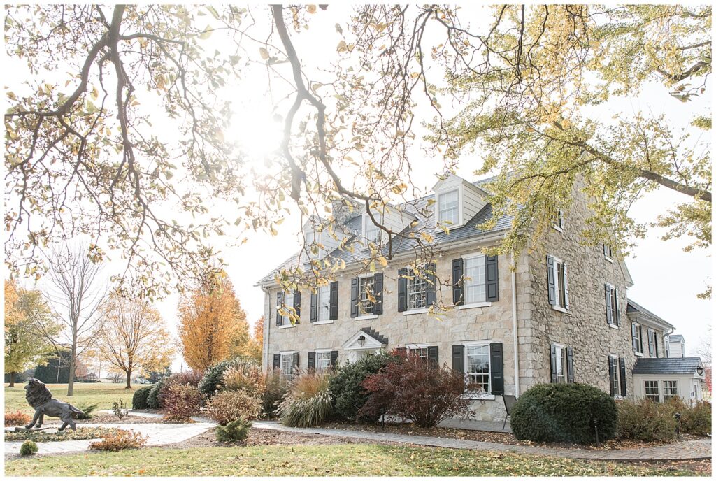 stunning barn at silverstone stone home on a sunny fall day for this Barn at Silverstone Fall Wedding