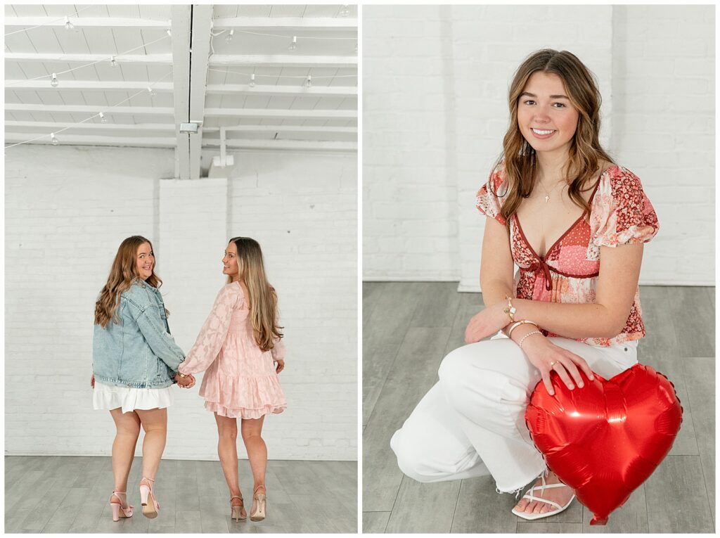 two girls holding hands and walking away from camera and also senior girl crouched down by right heart balloon for this Valentines Day BFF Shoot