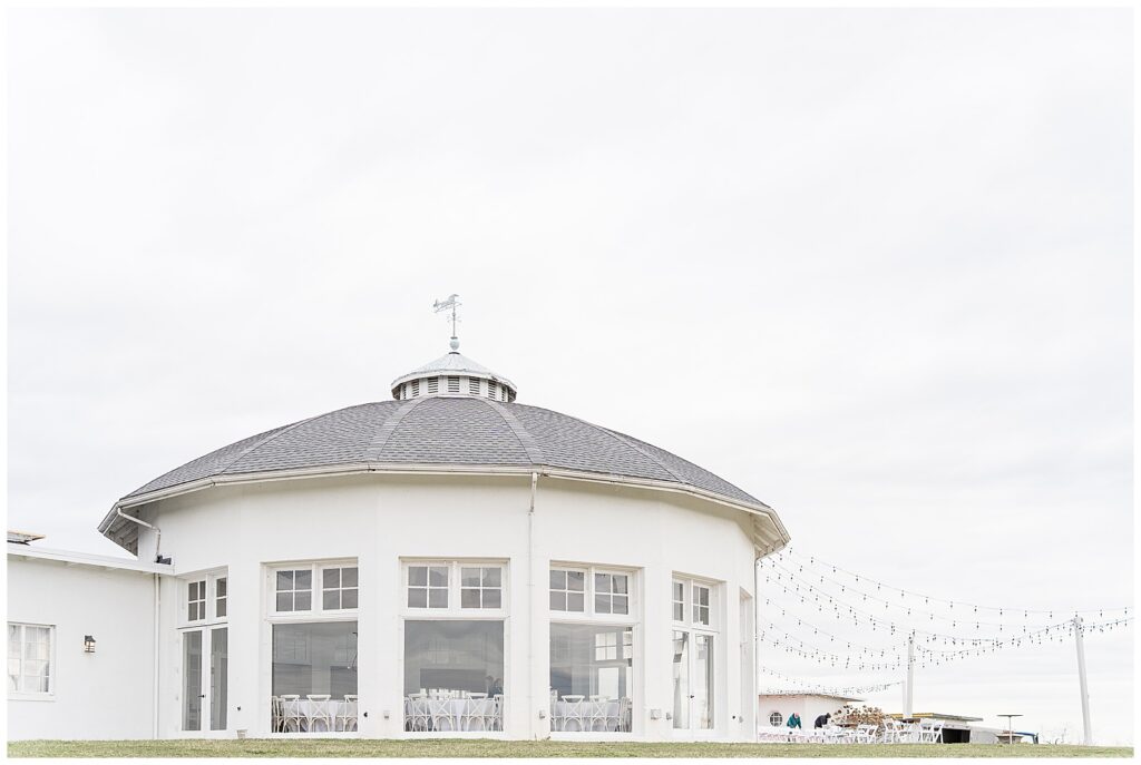 white round building on winter day for this Wedding at The Rotunda at Lauxmont Farms