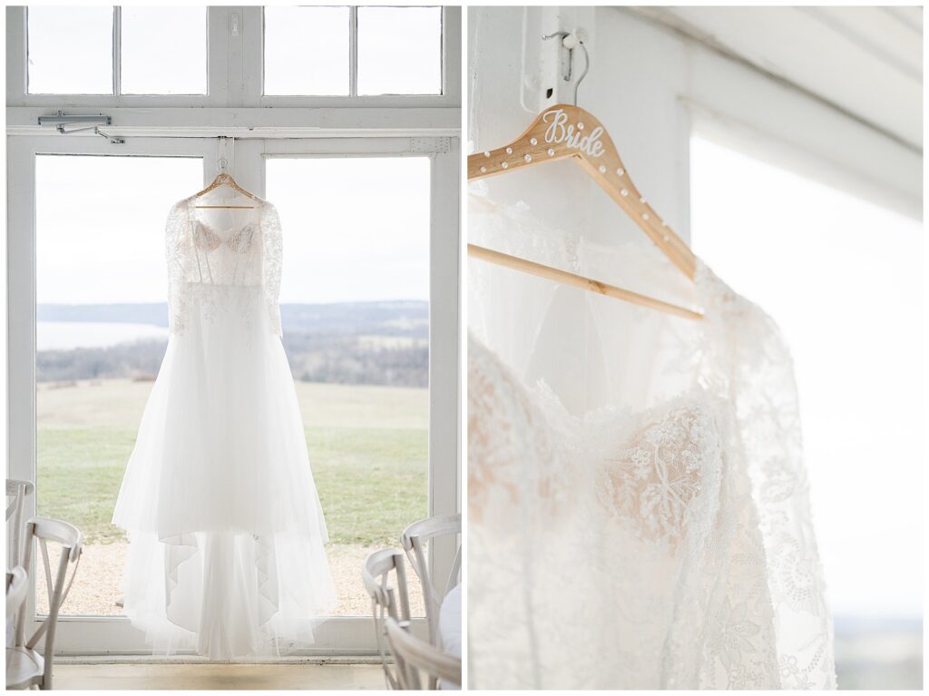 wedding dress hanging by large white doors for this Wedding at The Rotunda at Lauxmont Farms
