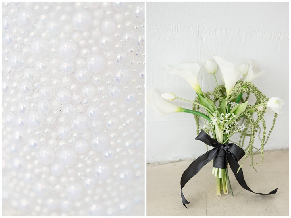 white lilies in vase with black ribbon tied around it for this Wedding at The Rotunda at Lauxmont Farms
