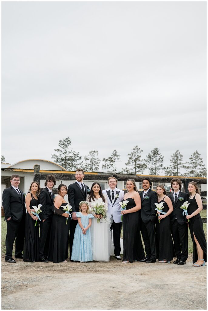 bride and groom with bridal party outside for this Wedding at The Rotunda at Lauxmont Farms