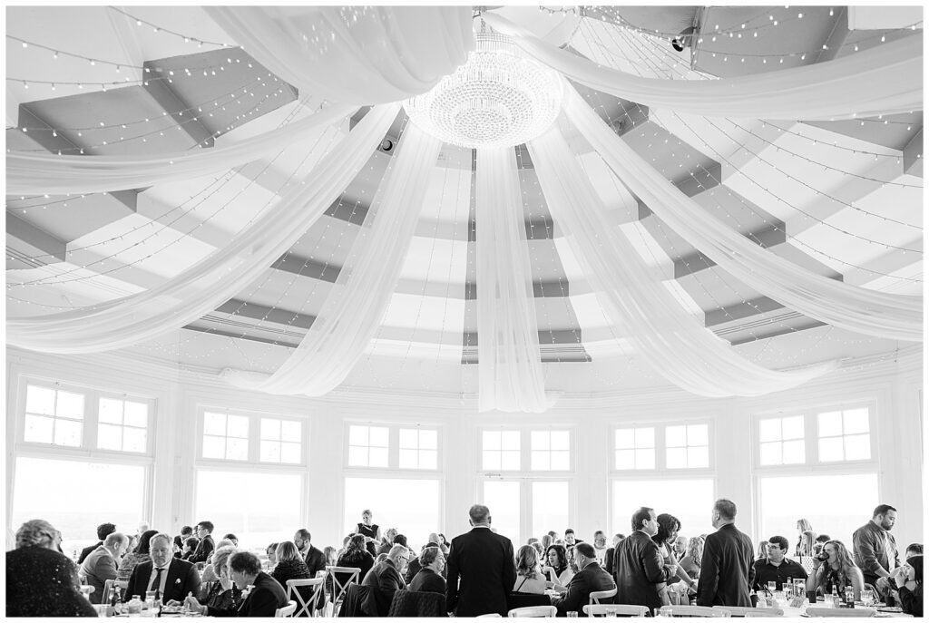 black and white photo of reception and guests for this Wedding at The Rotunda at Lauxmont Farms