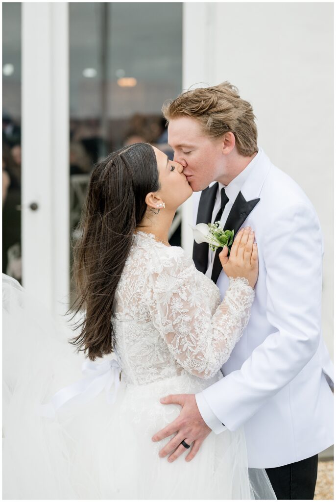 closeup photo of couple kissing on winter day for this Wedding at The Rotunda at Lauxmont Farms