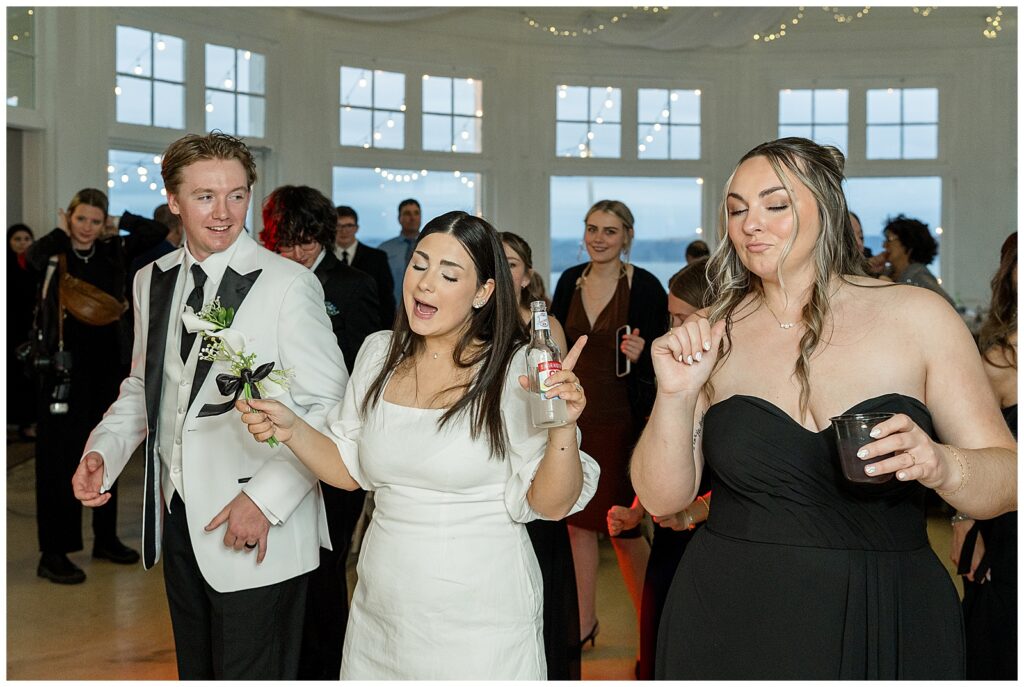 bride and groom singing and dancing with friends at reception for this Wedding at The Rotunda at Lauxmont Farms