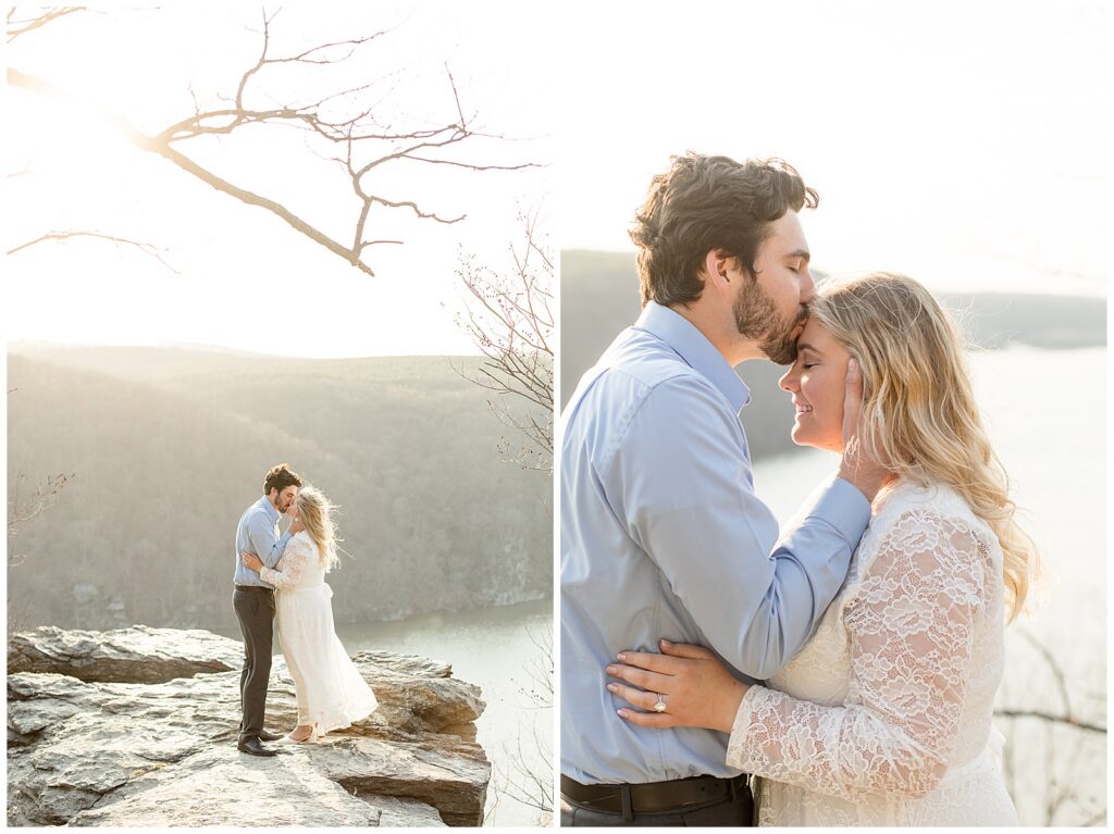 couple standing on rock and man kissing woman's forehead for this Pinnacle Point Spring Engagement Session