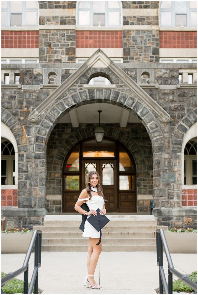 grad standing in front of historic building at Moravian University
