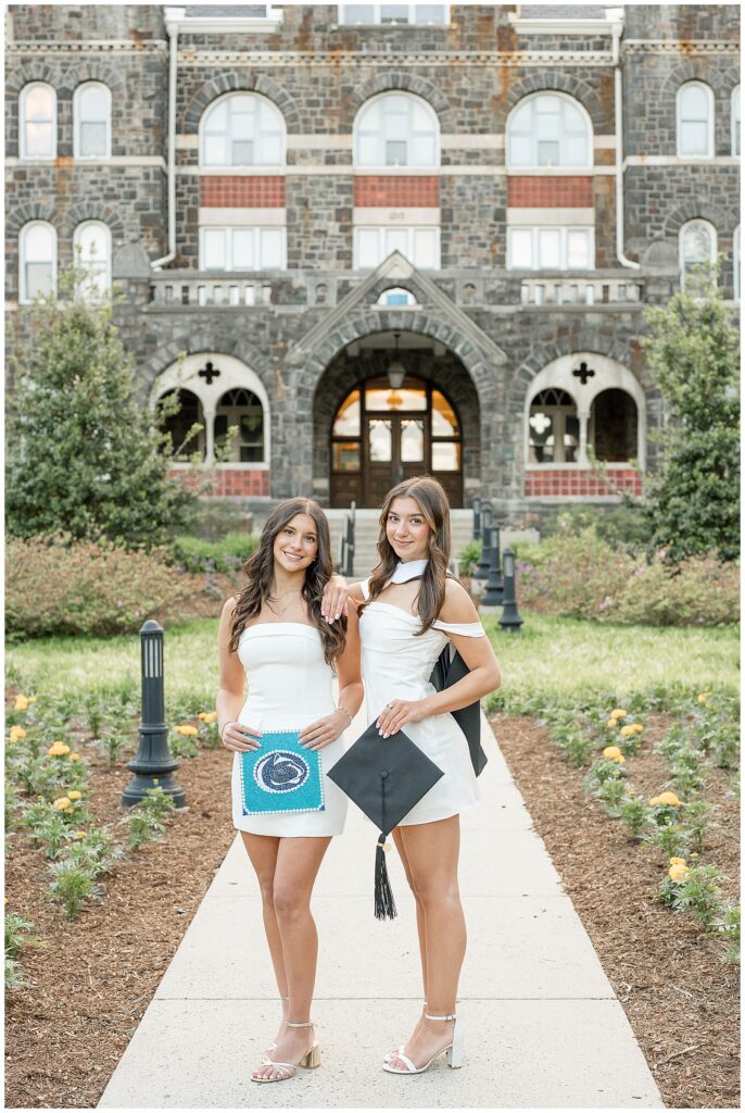 two sisters take graduate photos at Moravian University