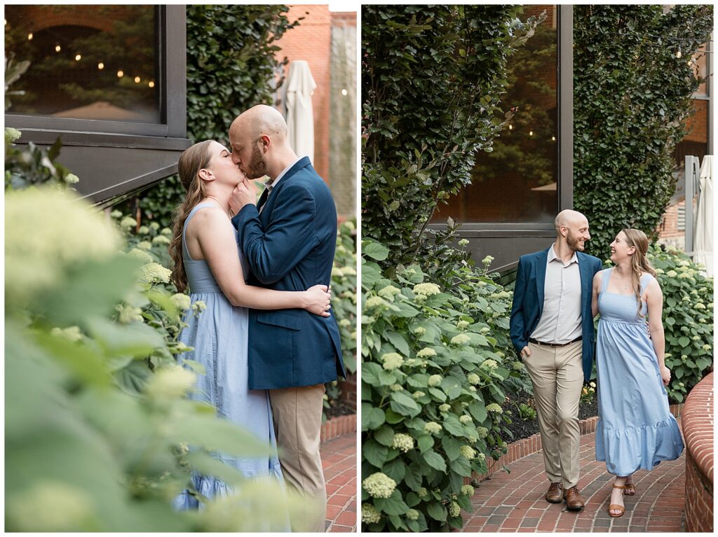 Engaged couple sharing a romantic kiss among hydrangeas and string lights at Old Trinity Place in downtown Lancaster PA, engagement photographer Heather Marie Photography