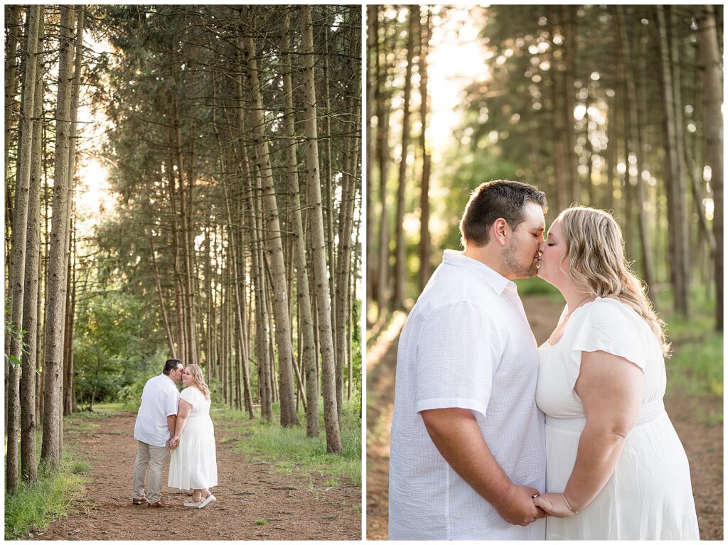 Engaged couple sharing a romantic kiss along a pine tree path at Overlook Park Lancaster PA during their summer golden hour engagement session